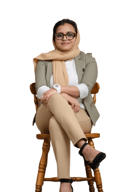 Jasmi Mullapally seated, smiling